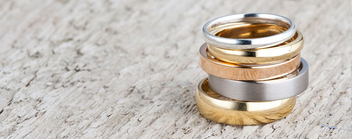 Gold, silver and platinum wedding rings